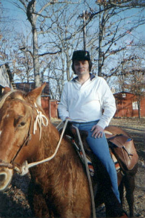 Ralph Burgess sitting on Betsy Tom Corey's Horse